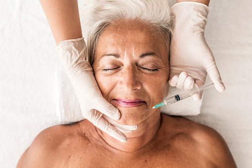 Senior woman getting botox treatment