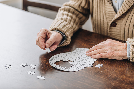 Senior adult working on a puzzle