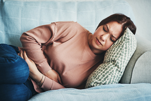 Woman not feeling well in her gut