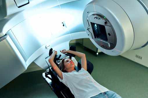 Woman receiving radiation therapy