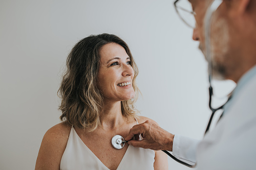 Woman with doctor getting a heart checkup