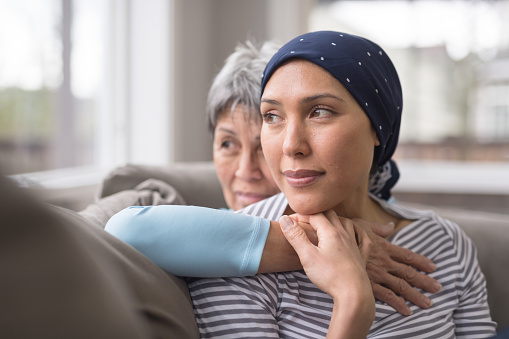Woman with mother looking out window