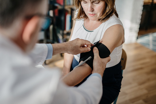 Woman getting her blood pressure checked