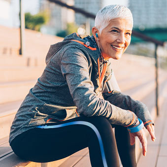 Senior woman resting while on a run